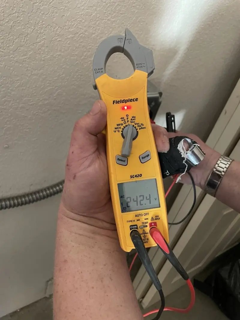 Voltage testing with clamp meter during Generator Installation in Felton